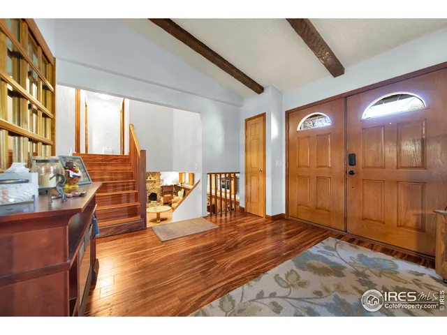 a view of a living room and a balcony