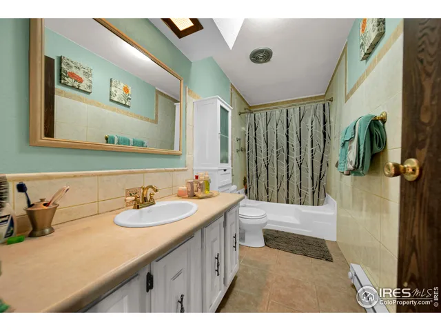 a bathroom with a sink a mirror and a toilet