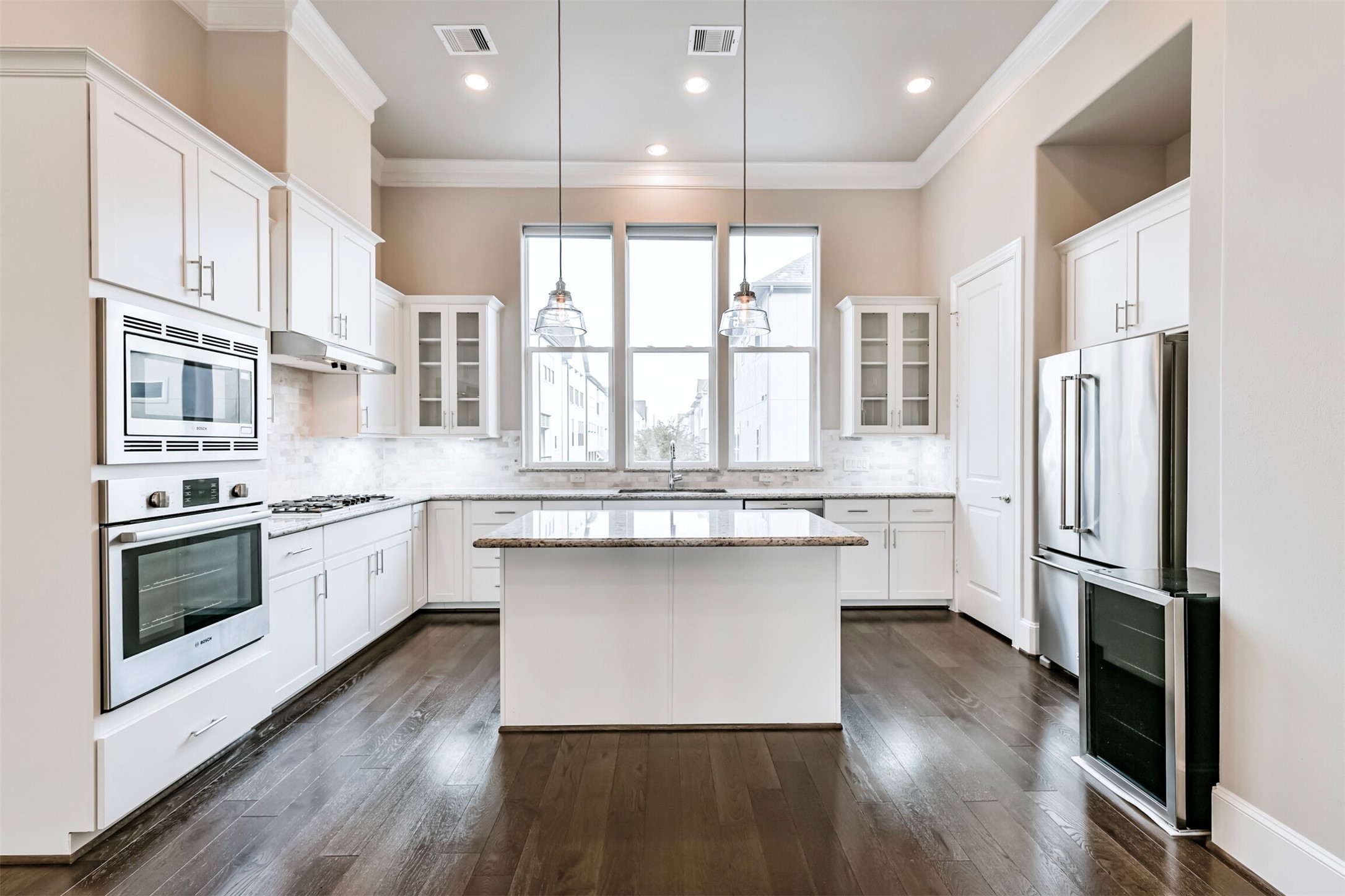 9507 London Bridge Station Houston, TX 77045 - Photo 2 of 32 a kitchen with stainless steel appliances granite countertop a refrigerator a sink dishwasher a stove and white cabinets with wooden floor