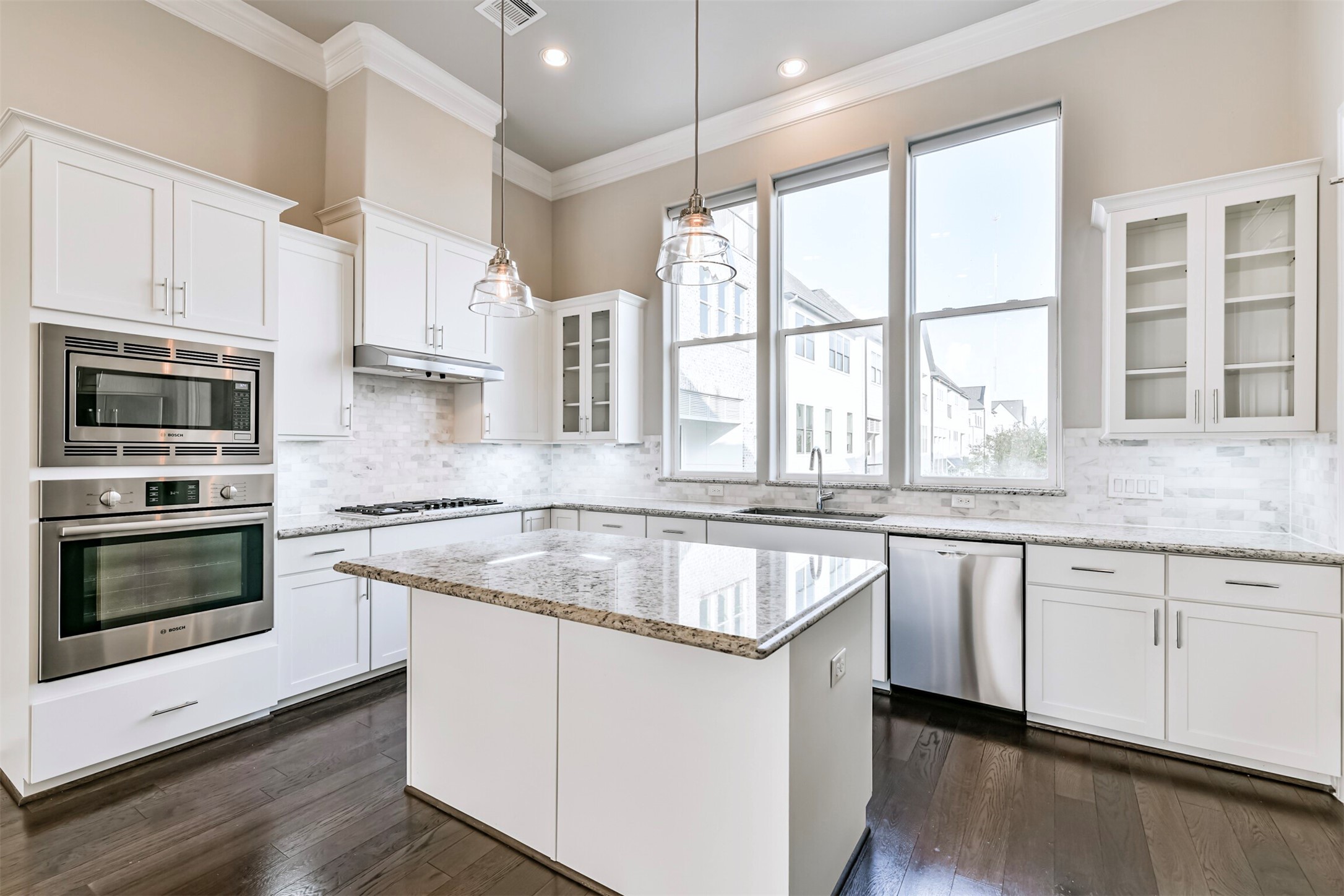 9507 London Bridge Station Houston, TX 77045 - Photo 3 of 32 a kitchen with stainless steel appliances granite countertop a stove a sink and a microwave