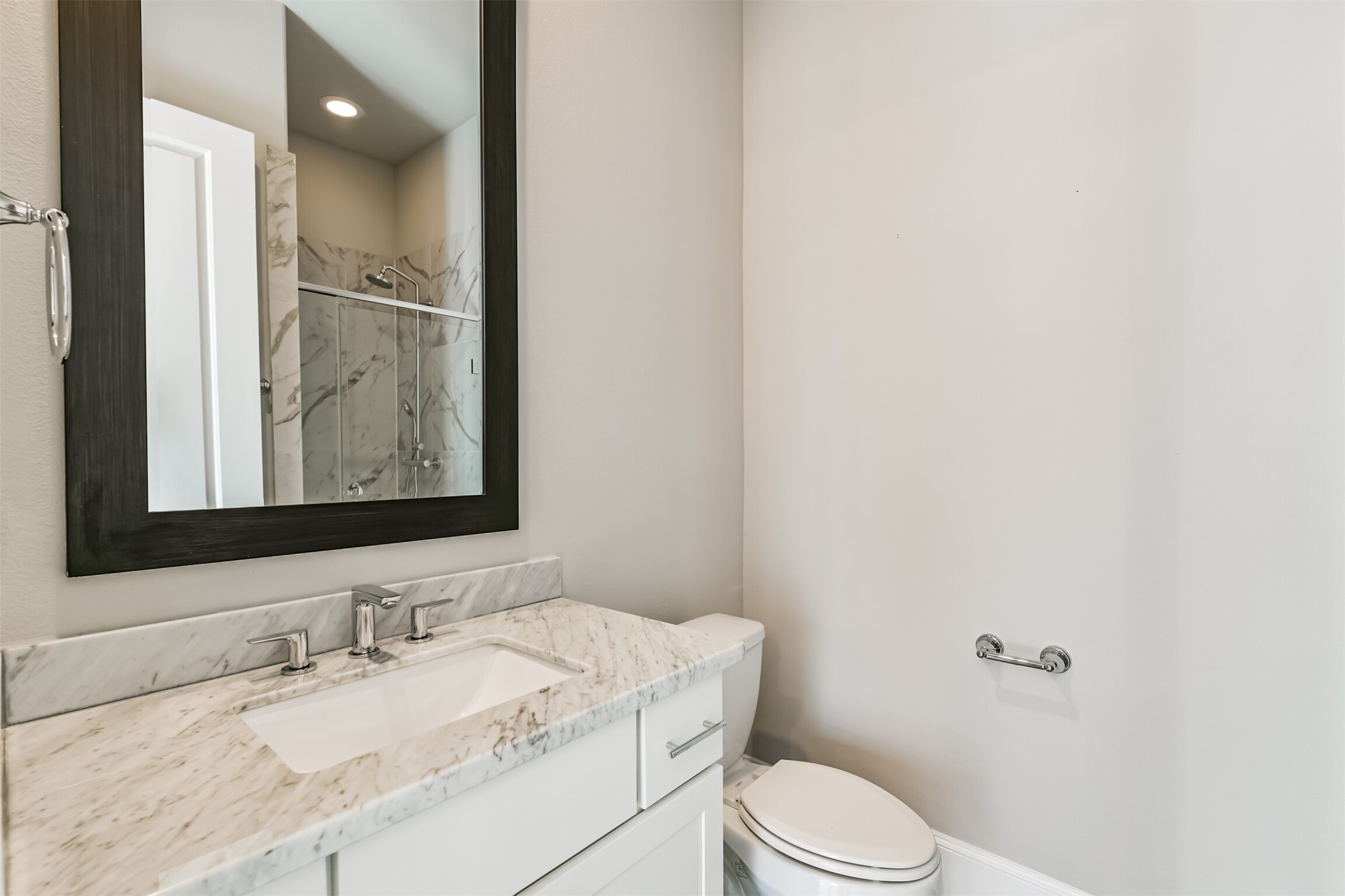 9507 London Bridge Station Houston, TX 77045 - Photo 9 of 32 a bathroom with a granite countertop sink mirror vanity and toilet