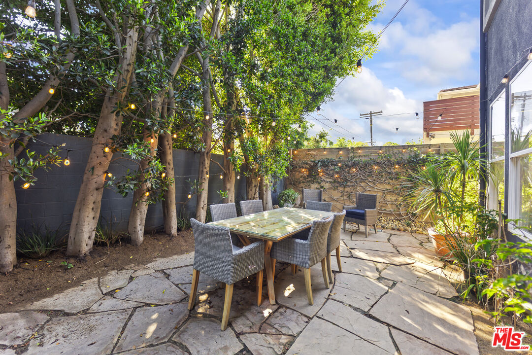 6738 Andover Lane Los Angeles, CA 90045 - Photo 12 of 24 a view of a patio with table and chairs and potted plants