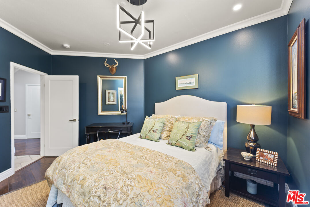 6738 Andover Lane Los Angeles, CA 90045 - Photo 18 of 24 a bedroom with a bed and wooden floor