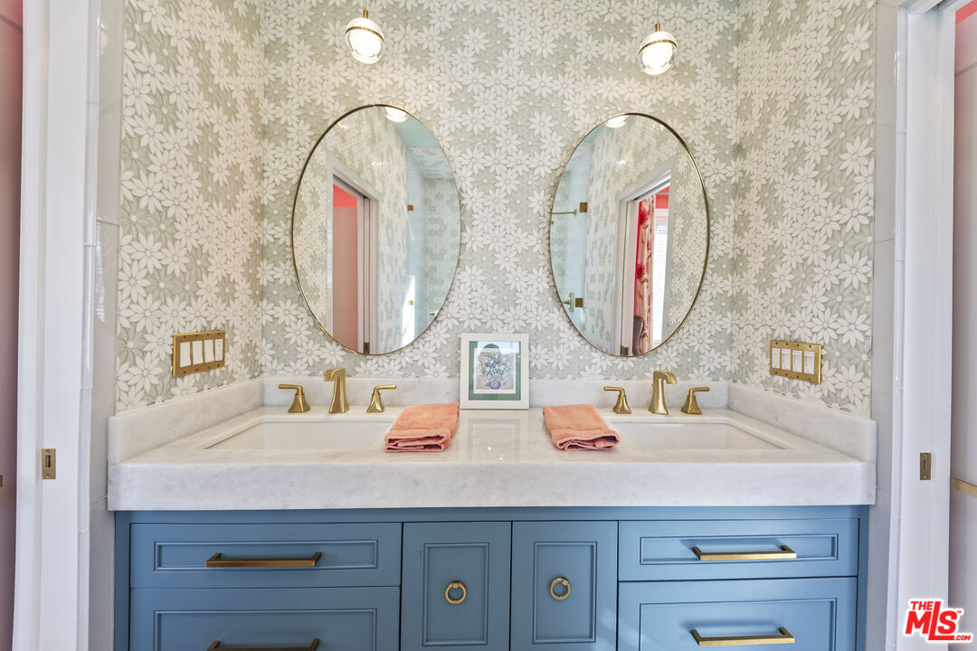6738 Andover Lane Los Angeles, CA 90045 - Photo 21 of 24 a bathroom with a double vanity sink and a mirror