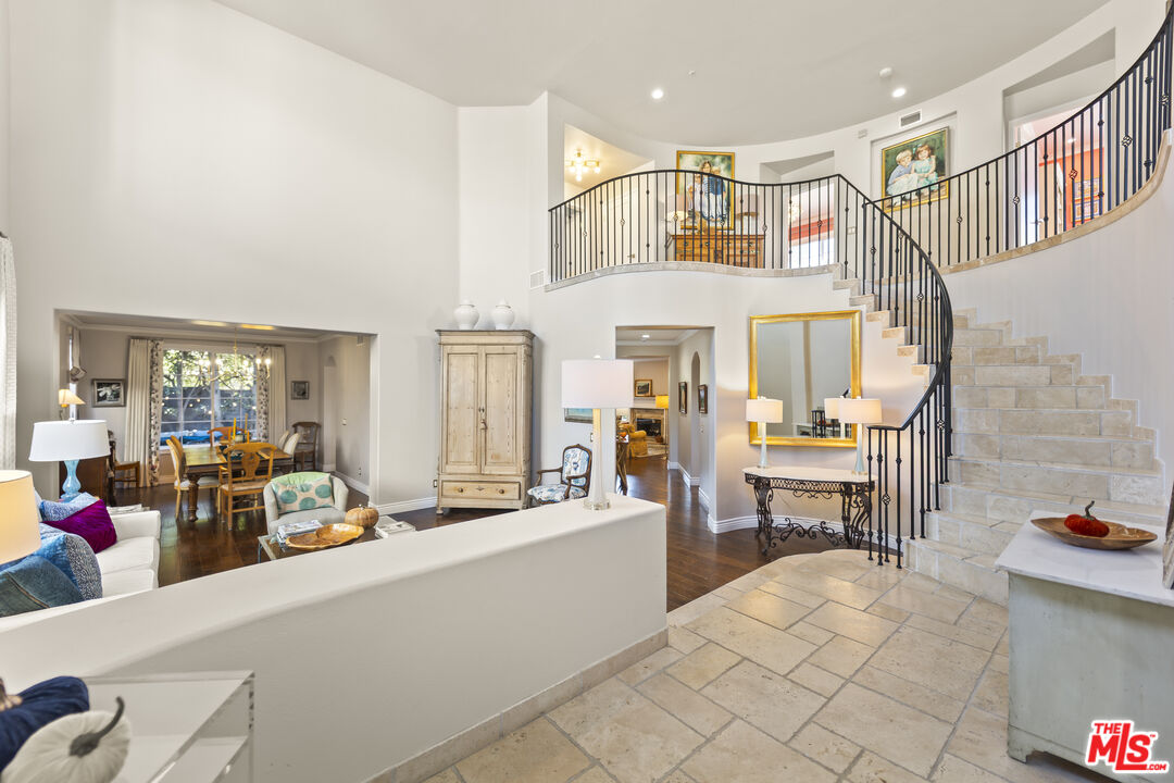 6738 Andover Lane Los Angeles, CA 90045 - Photo 4 of 24 a living room with furniture a fireplace and large windows