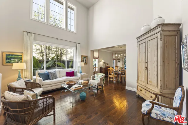 a living room with furniture window and wooden floor