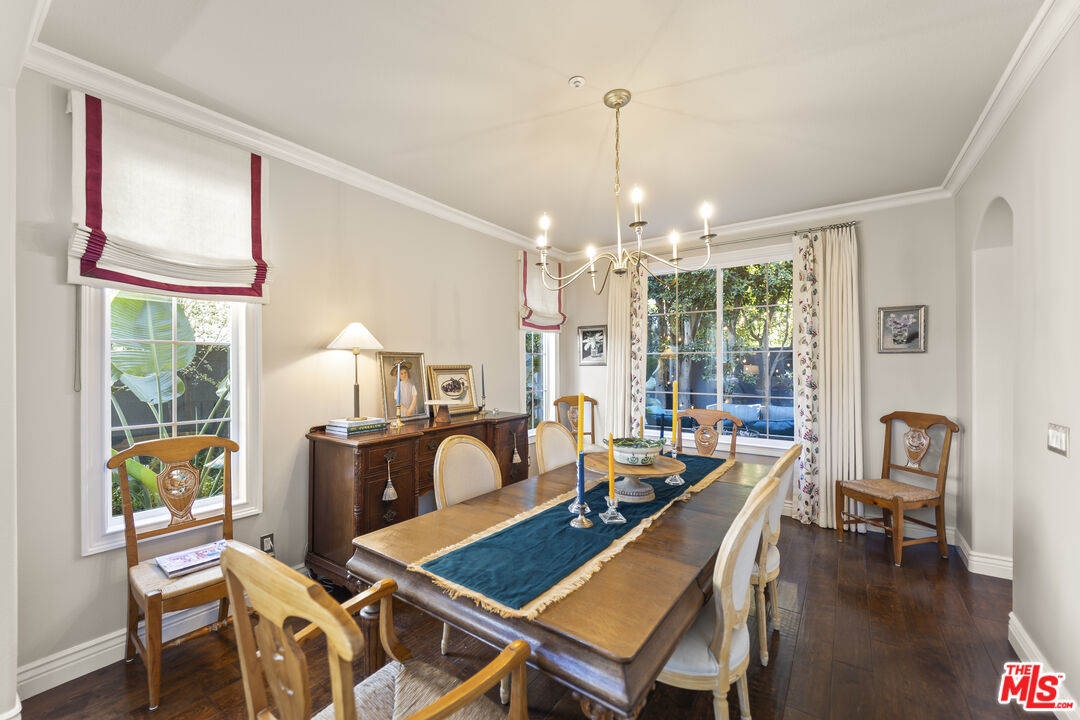 6738 Andover Lane Los Angeles, CA 90045 - Photo 6 of 24 a view of a dining room with furniture a chandelier and wooden floor