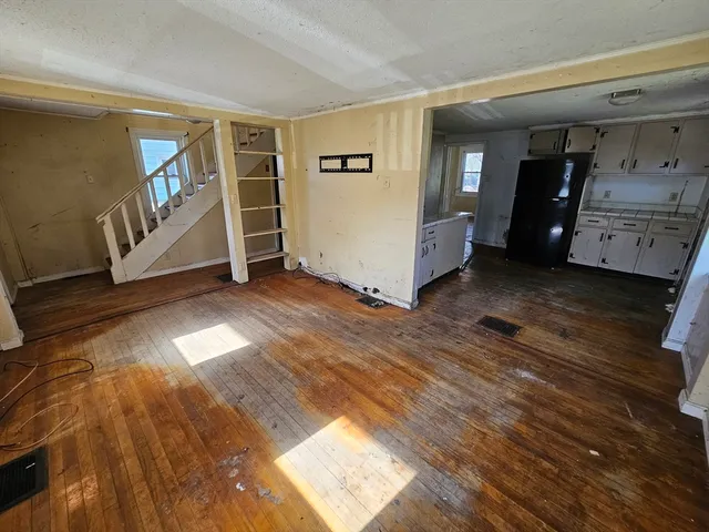 a view of an empty room with closet