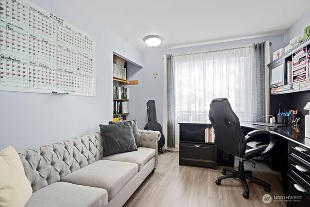 a living room with furniture and a window