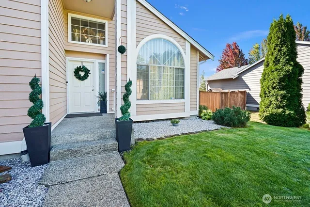 a front view of a house with garden