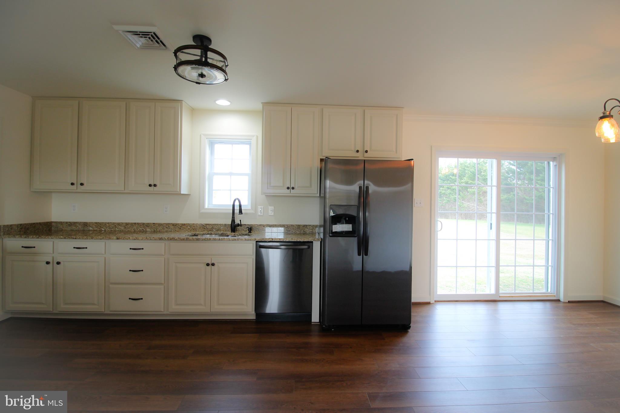128 Sutton Road Abbottstown, PA 17301 - Photo 14 of 35 Sliding Patio Door leads to backyard