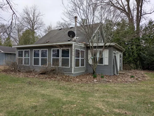a house with trees in the background