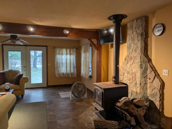 a view of a livingroom with furniture and windows