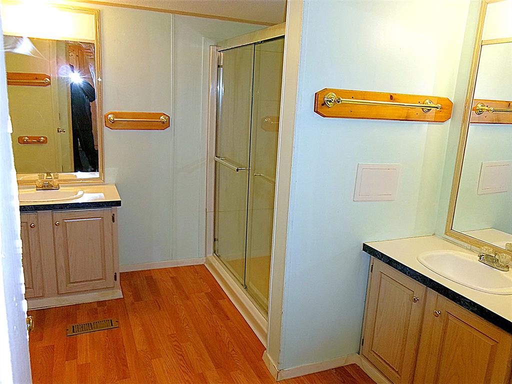 3231 Portside Drive May, TX 76857 - Photo 12 of 26 a bathroom with a sink a toilet and mirror
