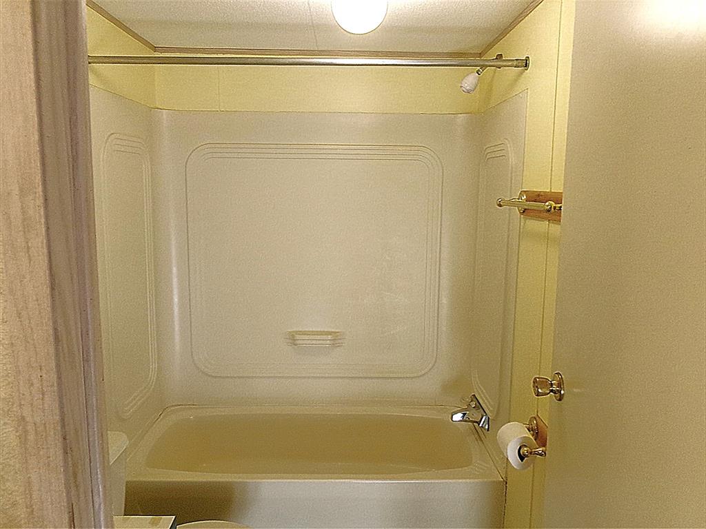 3231 Portside Drive May, TX 76857 - Photo 16 of 26 a bathroom with a shower and a bath tub