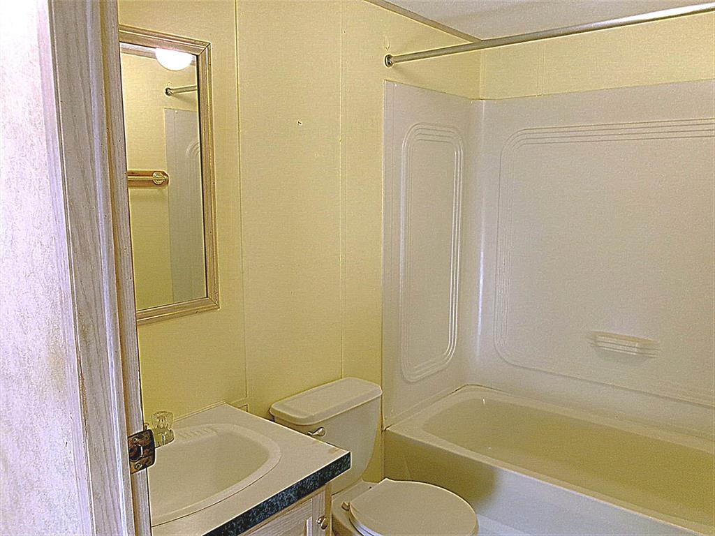 3231 Portside Drive May, TX 76857 - Photo 17 of 26 a bathroom with a sink toilet and shower