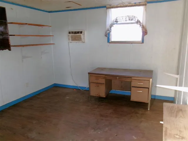 a room with lots of white furniture and a chandelier