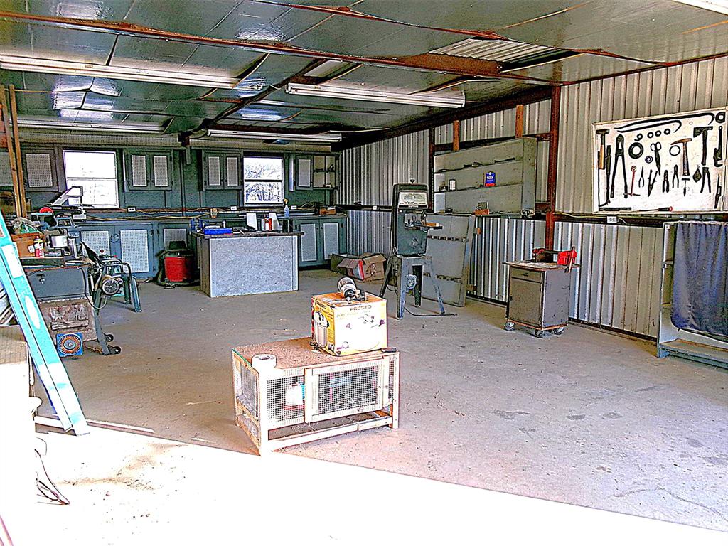 3231 Portside Drive May, TX 76857 - Photo 24 of 26 a room with lots of white furniture and a chandelier