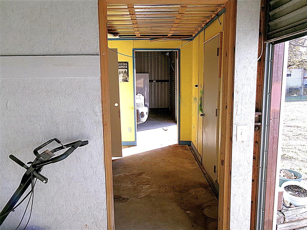 3231 Portside Drive May, TX 76857 - Photo 25 of 26 a view of a hallway with wooden floor and closet