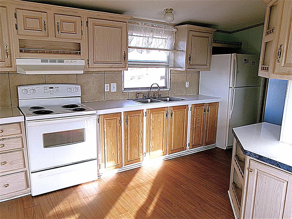 3231 Portside Drive May, TX 76857 - Photo 8 of 26 a kitchen with stainless steel appliances a stove a refrigerator and cabinets