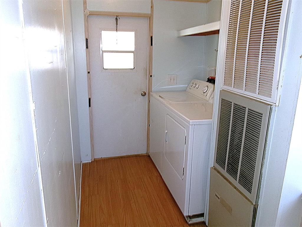 3231 Portside Drive May, TX 76857 - Photo 9 of 26 a bathroom with a sink a bath tub and a window