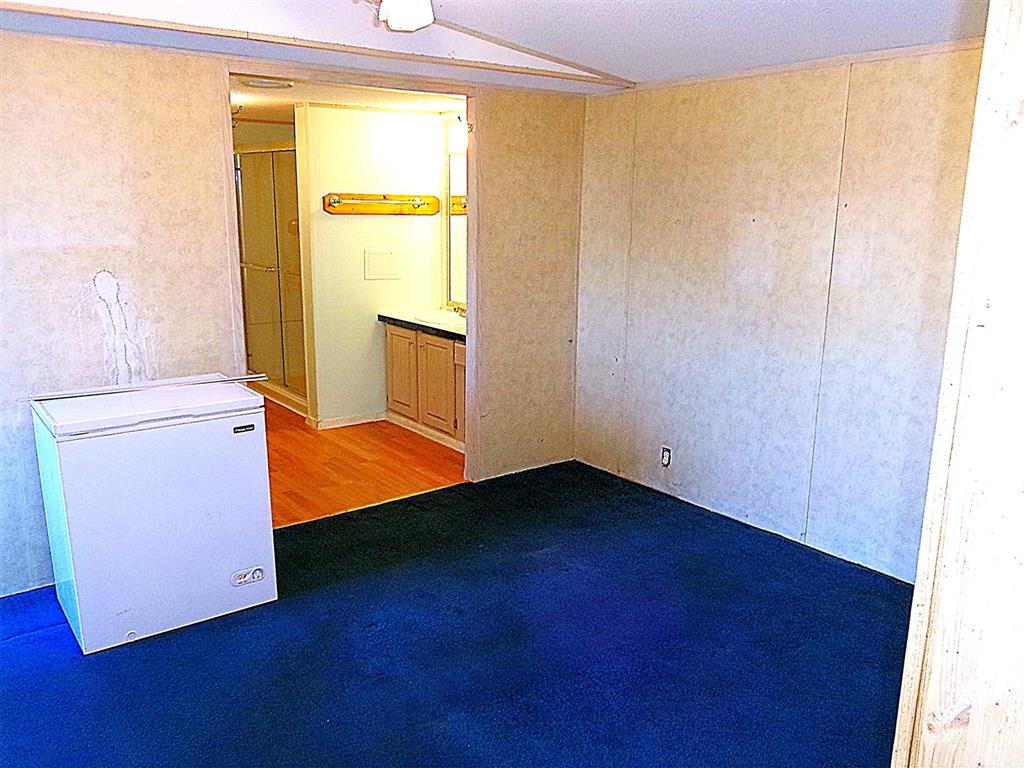 3231 Portside Drive May, TX 76857 - Photo 10 of 26 wooden floor in an empty room with a window