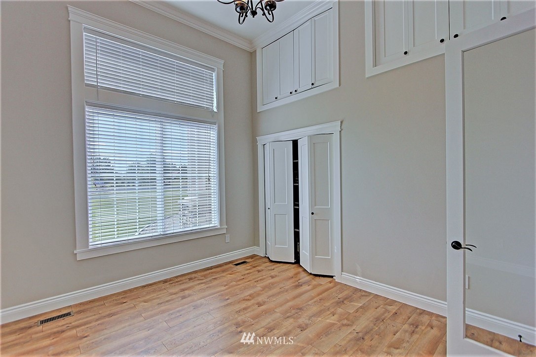6737 Rd D.8 Northeast Moses Lake, WA 98837 - Photo 12 of 24 a view of an empty room with window and cabinet area