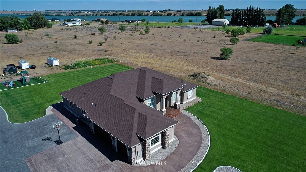 6737 Rd D.8 Northeast Moses Lake, WA 98837 - Photo 4 of 24 an aerial view of a house with a yard