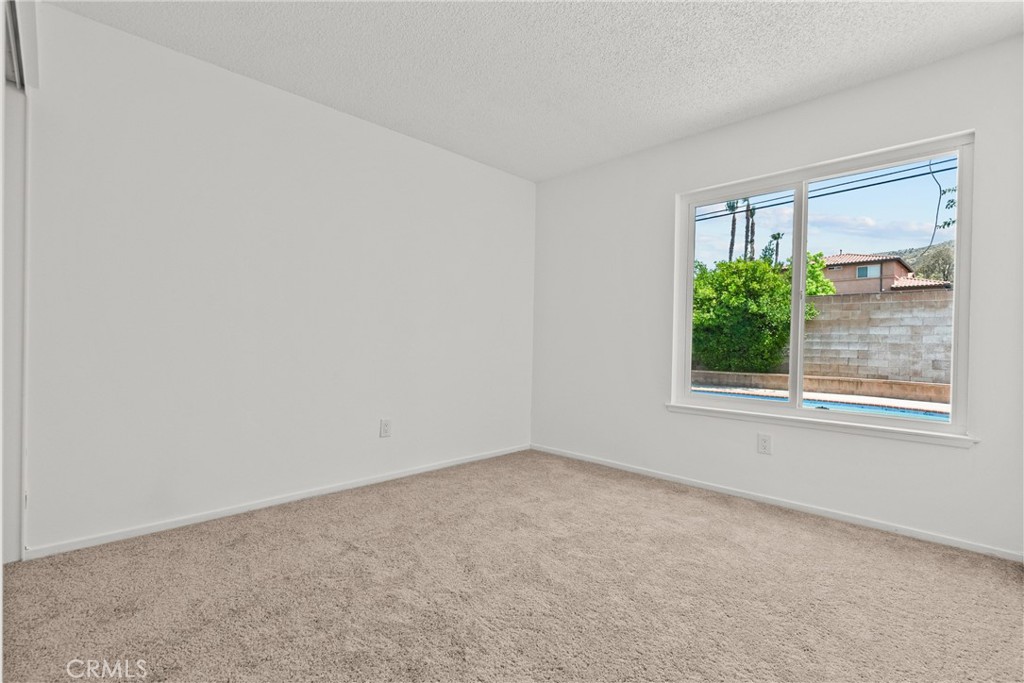 21124 Rosedell Drive Saugus, CA 91350 - Photo 6 of 14 an empty room with a window