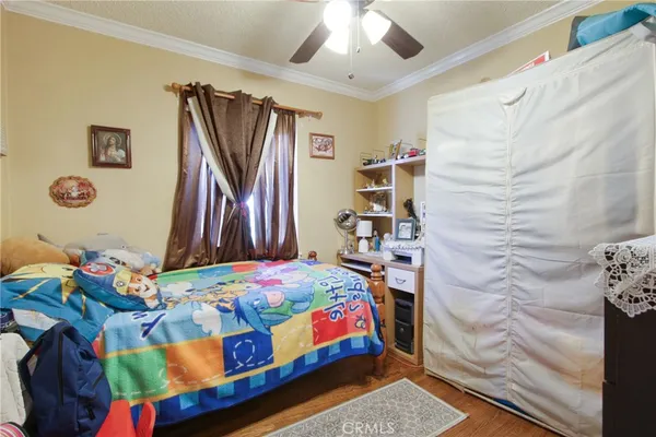 a bedroom with a bed and a book shelf