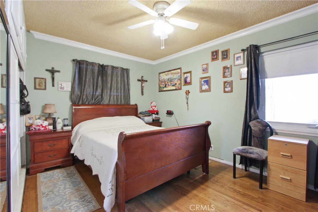 618 East 225th Street Carson, CA 90745 - Photo 10 of 14 a bed room with a bed and a chair