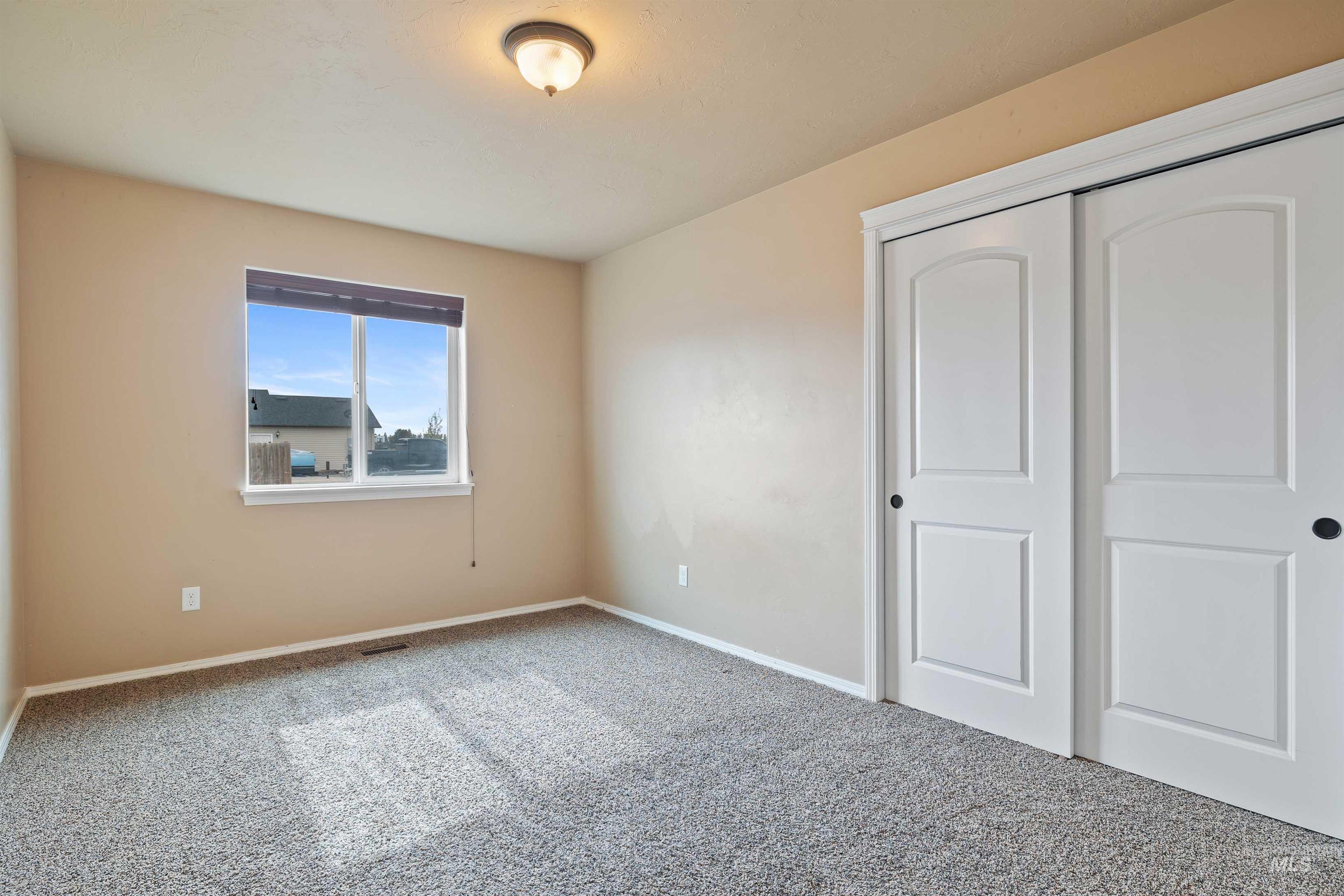 134 North 50 West Rupert, ID 83350 - Photo 13 of 36 Unfurnished bedroom with carpet flooring and a closet