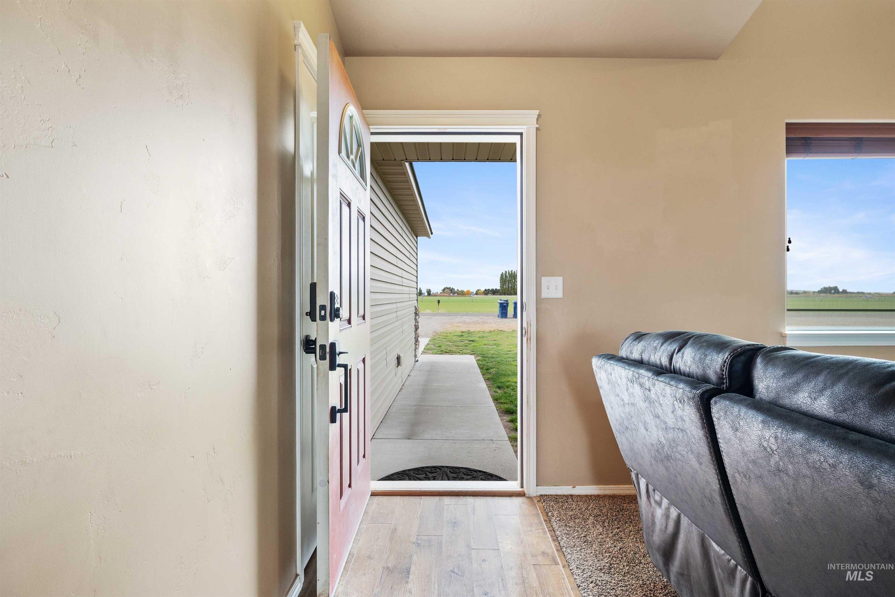 134 North 50 West Rupert, ID 83350 - Photo 3 of 36 Entryway featuring wood finished floors and baseboards
