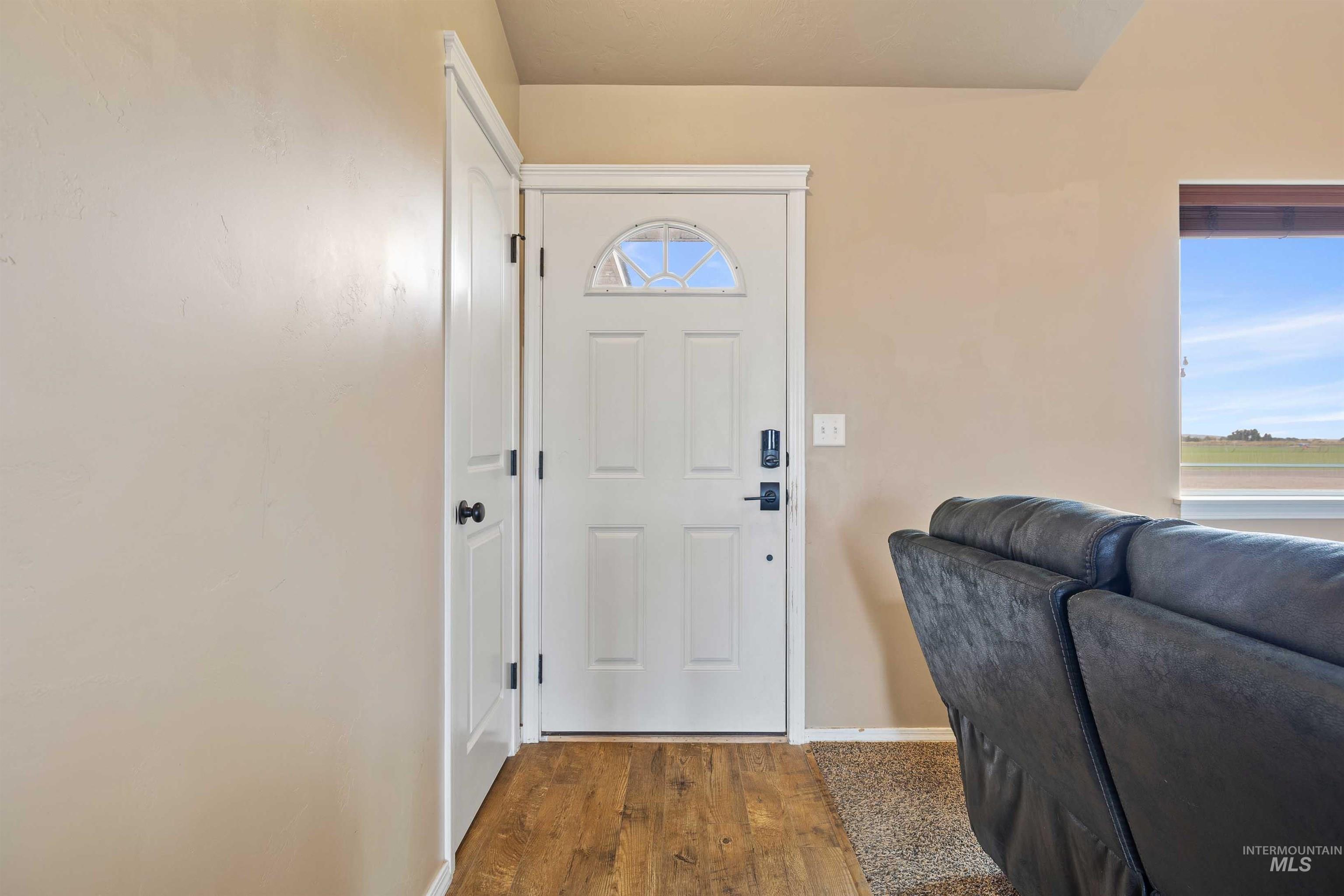 134 North 50 West Rupert, ID 83350 - Photo 4 of 36 Entrance foyer with baseboards and dark wood-style floors