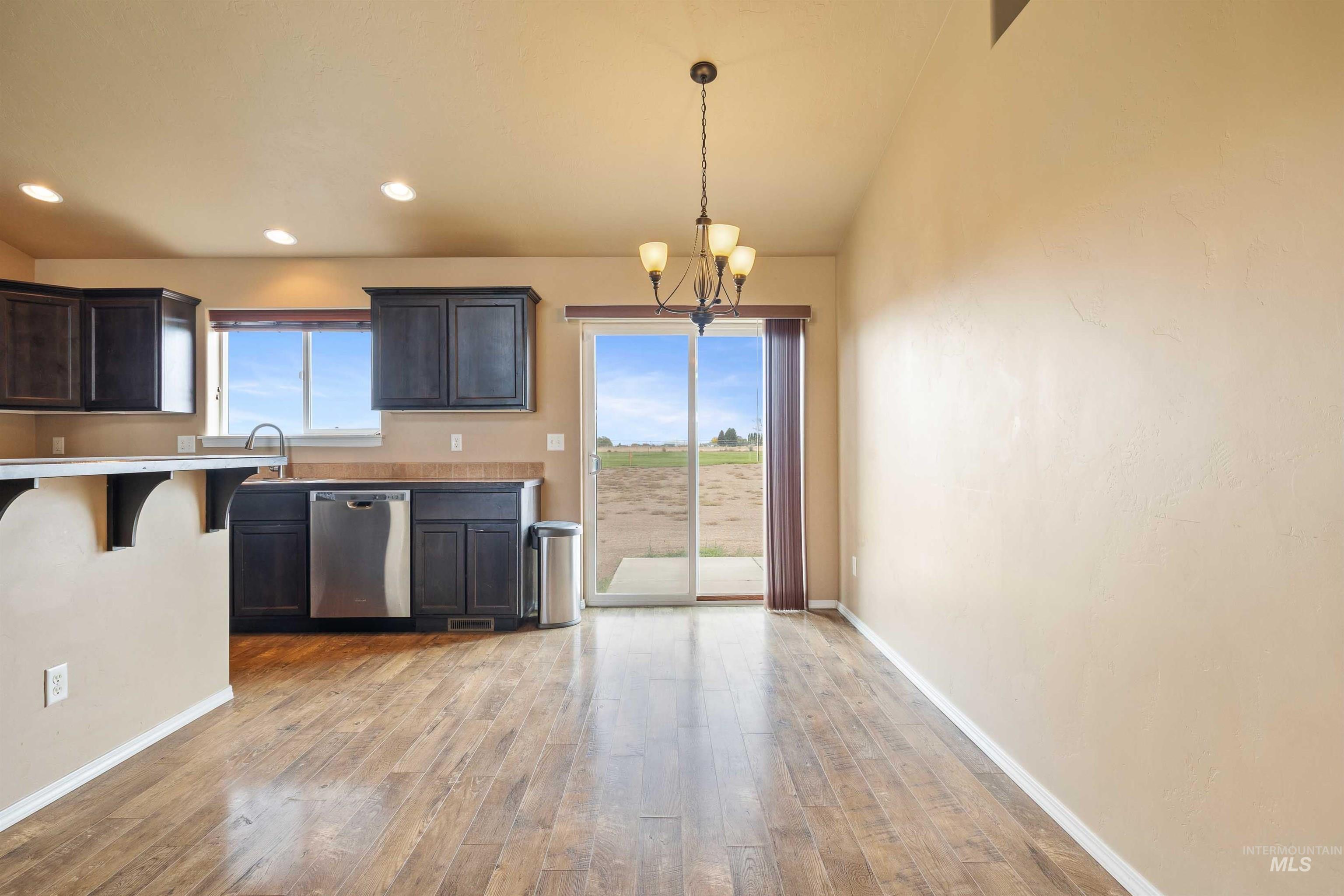 134 North 50 West Rupert, ID 83350 - Photo 7 of 36 Kitchen featuring a chandelier, light wood-type flooring, dishwasher, hanging light fixtures, and recessed lighting