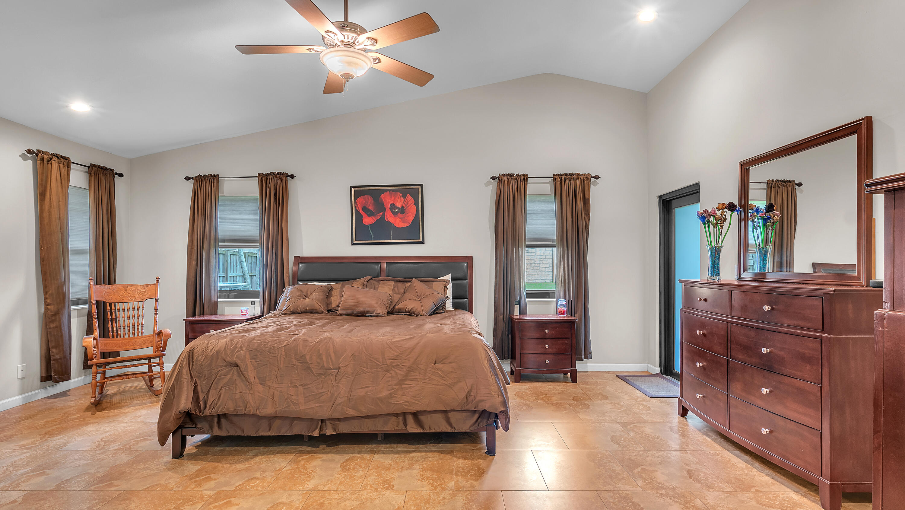 19379 Delaware Circle Boca Raton, FL 33434 - Photo 29 of 45 a bedroom with a bed and dresser with mirror