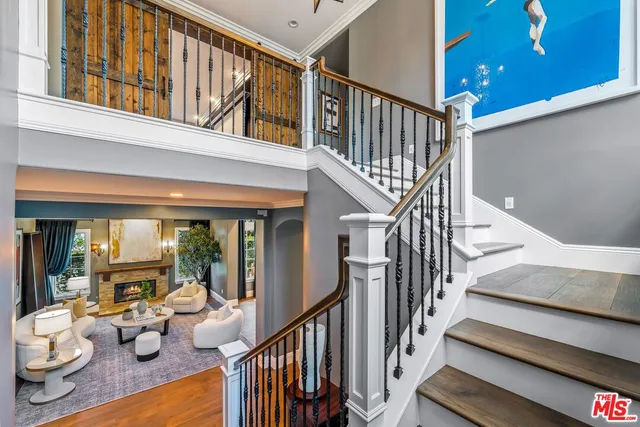 a spacious bedroom with a large bed and a flat screen tv