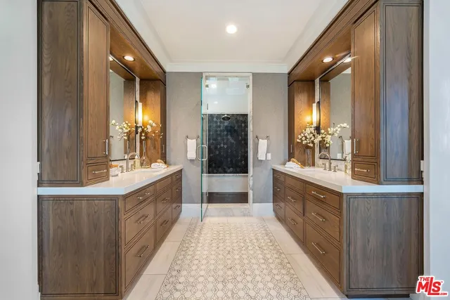 a spacious bedroom with a bed and a flat screen tv