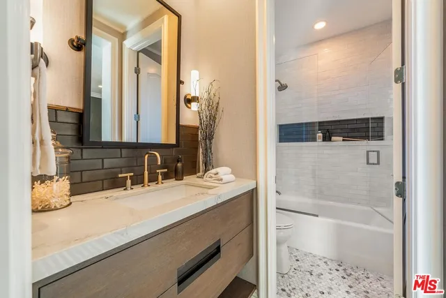 a view of living room with a bath tub and shower