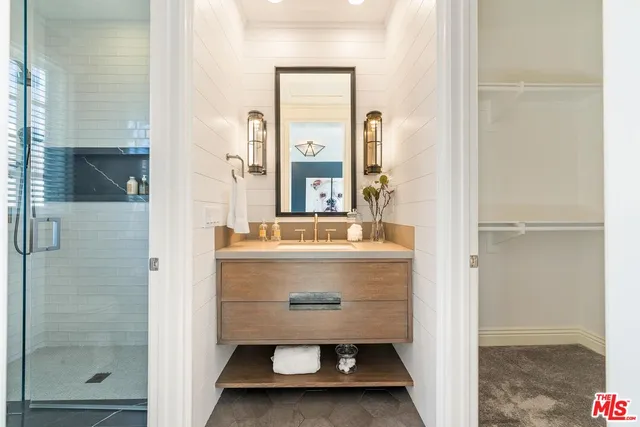 a view of a patio with swimming pool and sitting space