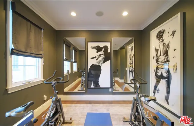 a view of roof deck with couches and city view