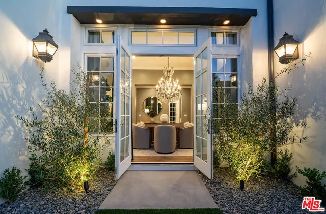 a kitchen with stainless steel appliances granite countertop a sink and cabinets with wooden floor