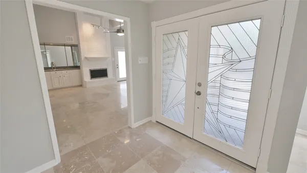 a view of a kitchen with a refrigerator and a sink