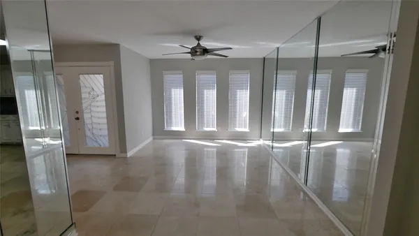 a view of a hallway with a white walls