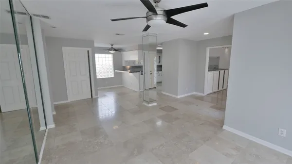 a view of a kitchen with a sink and cabinet area