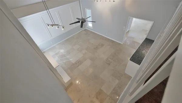 an empty room with closet and a ceiling fan