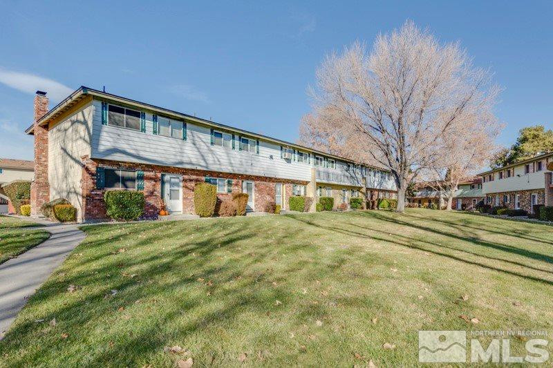 404 Smithridge Drive Reno, NV 89502 - Photo 1 of 12 a view of a big building with large trees