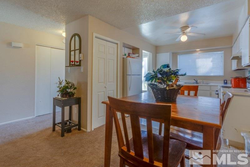 404 Smithridge Drive Reno, NV 89502 - Photo 5 of 12 a dining room with furniture and wooden floor