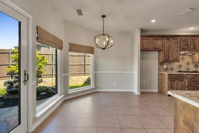a view of a kitchen with a sink and a window
