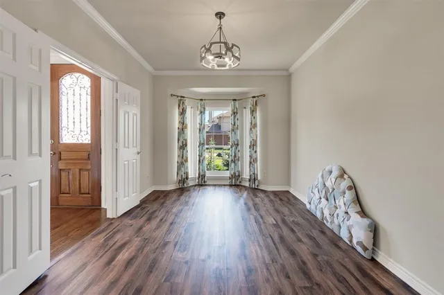 a view of entryway with wooden floor